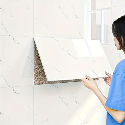 Nutshell self-adhesive decorative tiles being installed on a kitchen wall for easy decor updating