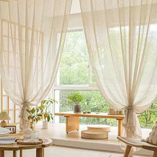 Nutshell Cotton Linen Beige Sheer Curtains draped over a sunny window seat tied back to filter soft natural light