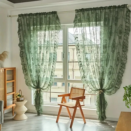 Nutshell Ruffled Floral Sheer Curtain in sage green tied back over large window in sunlit living room