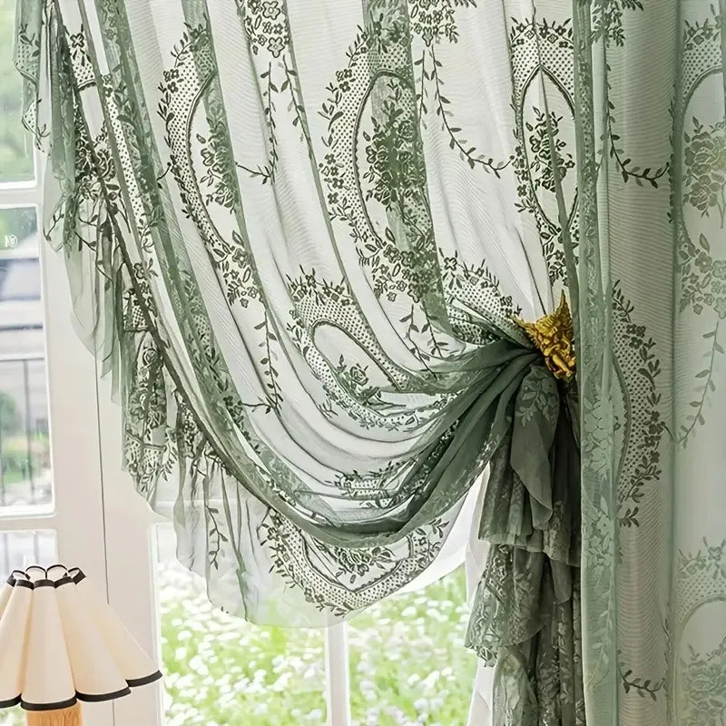 Nutshell green Ruffled Floral Sheer Curtain tied back with gold brooch revealing floral print and ruffles