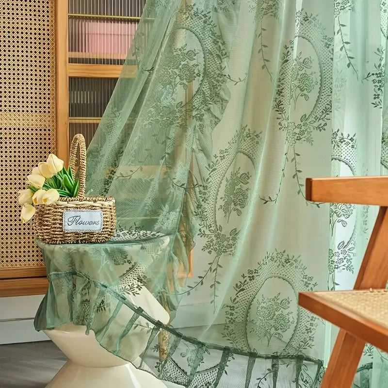 Nutshell Ruffled Floral Sheer Curtain in sage green with embroidered medallions and ruffled hem styling for airy windows