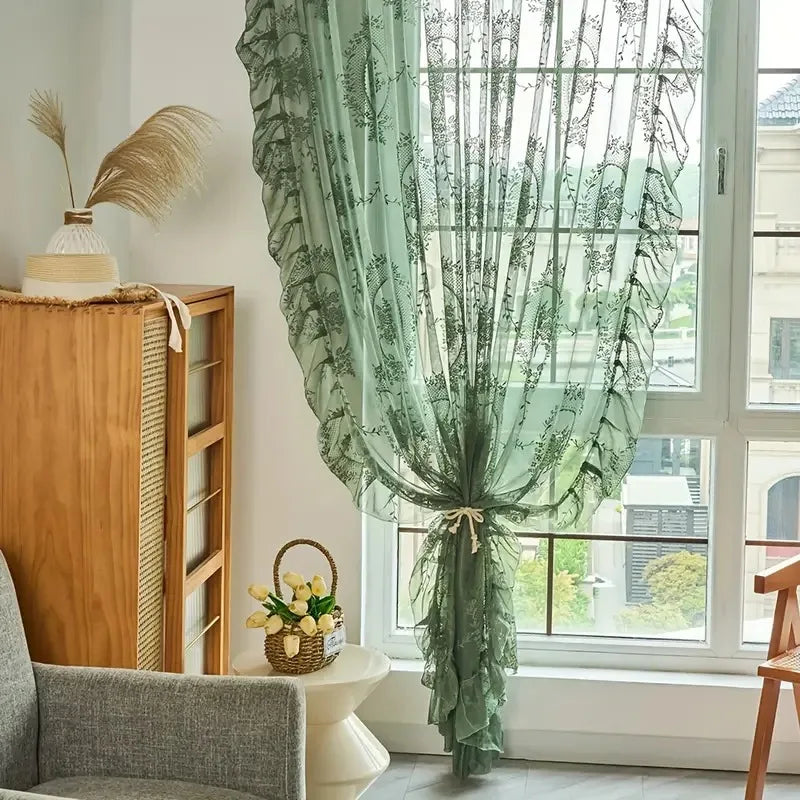 Ruffled Floral Sheer Curtain in sage green tied at center over living room window by Nutshell