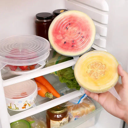Silicone Stretch Lid set in use on fruits inside a refrigerator for food storage and preservation