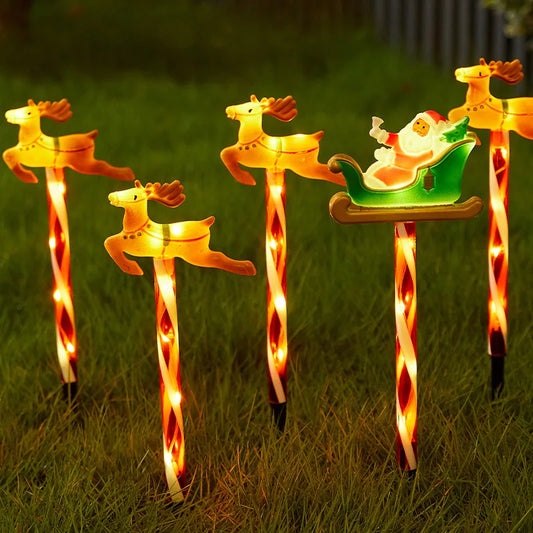 Decorative solar Christmas pathway lights with Santa in a sleigh and reindeer for festive outdoor decor