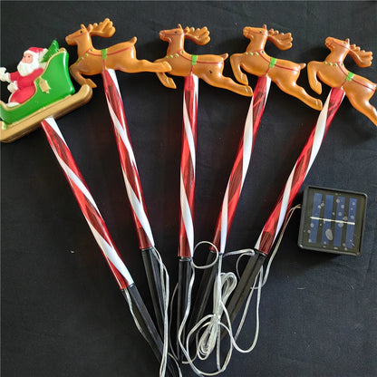 Nutshell solar Christmas pathway lights featuring Santa on a sleigh with reindeer for festive holiday decor