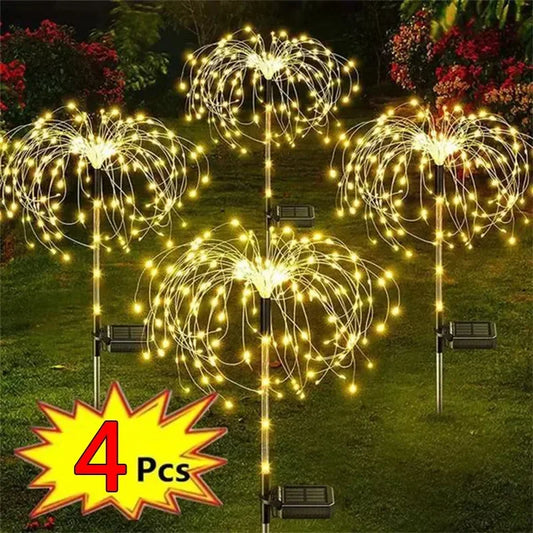 4 Pcs solar firework garden lights glowing brightly in a garden setting for festive illumination