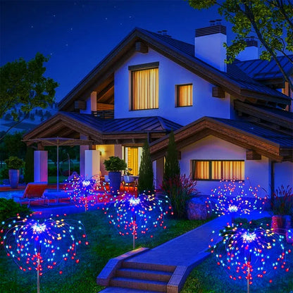 Nutshell solar fireworks lights outdoor illuminating a garden pathway with vibrant colors at night