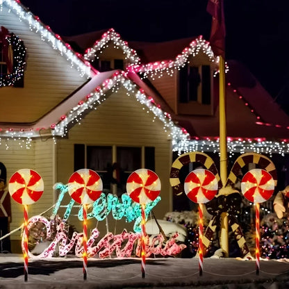 Decorative solar powered candy cane outdoor lights illuminating a festive Christmas display