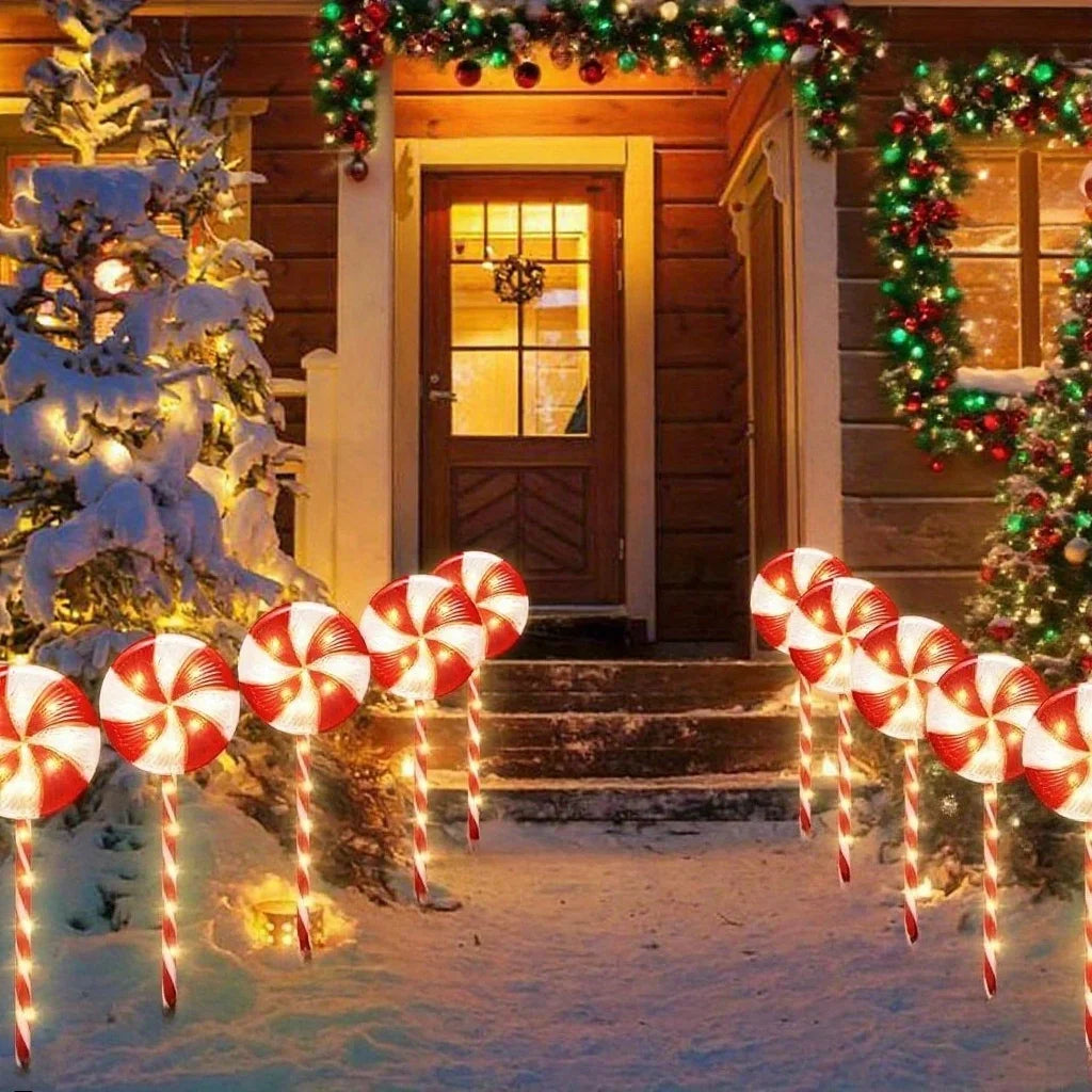 Colorful solar powered candy cane outdoor lights illuminating the snowy entrance during the holiday season