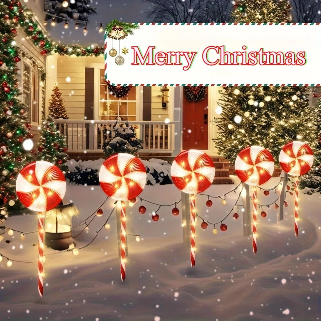 Solar powered candy cane outdoor lights for festive Christmas decorations in a winter landscape