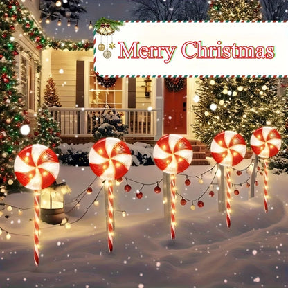 Solar powered candy cane outdoor lights for festive Christmas decorations in a winter landscape