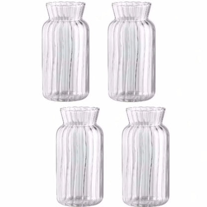 Set of four transparent glass vases for flowers with ribbed design, perfect for floral arrangements