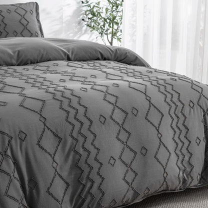 Nutshell tufted gray duvet cover set with geometric stitched pattern on a bed in a bright room