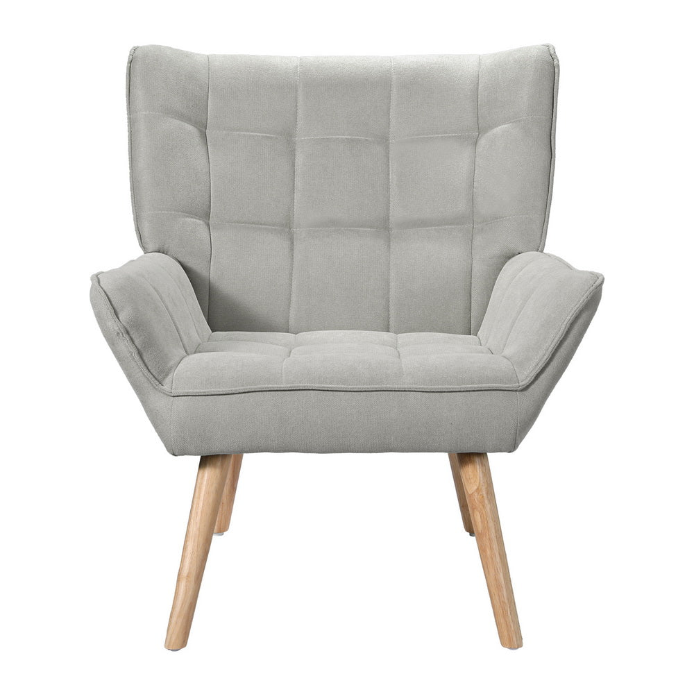 Nutshell Tufted Wingback Armchair in light gray with wooden legs and modern design