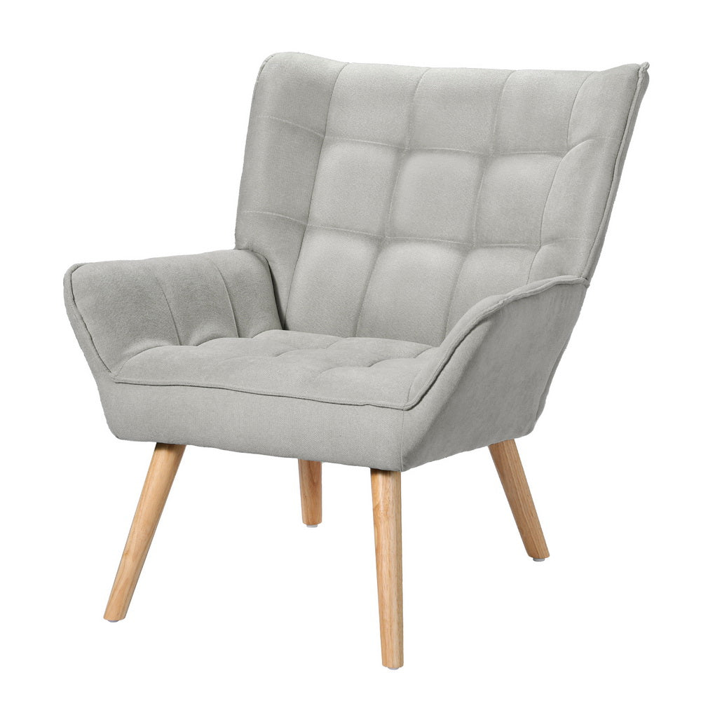 Nutshell Tufted Wingback Armchair in light gray fabric with wooden legs and comfortable padded design