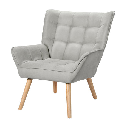 Nutshell Tufted Wingback Armchair in light gray fabric with wooden legs and comfortable padded design