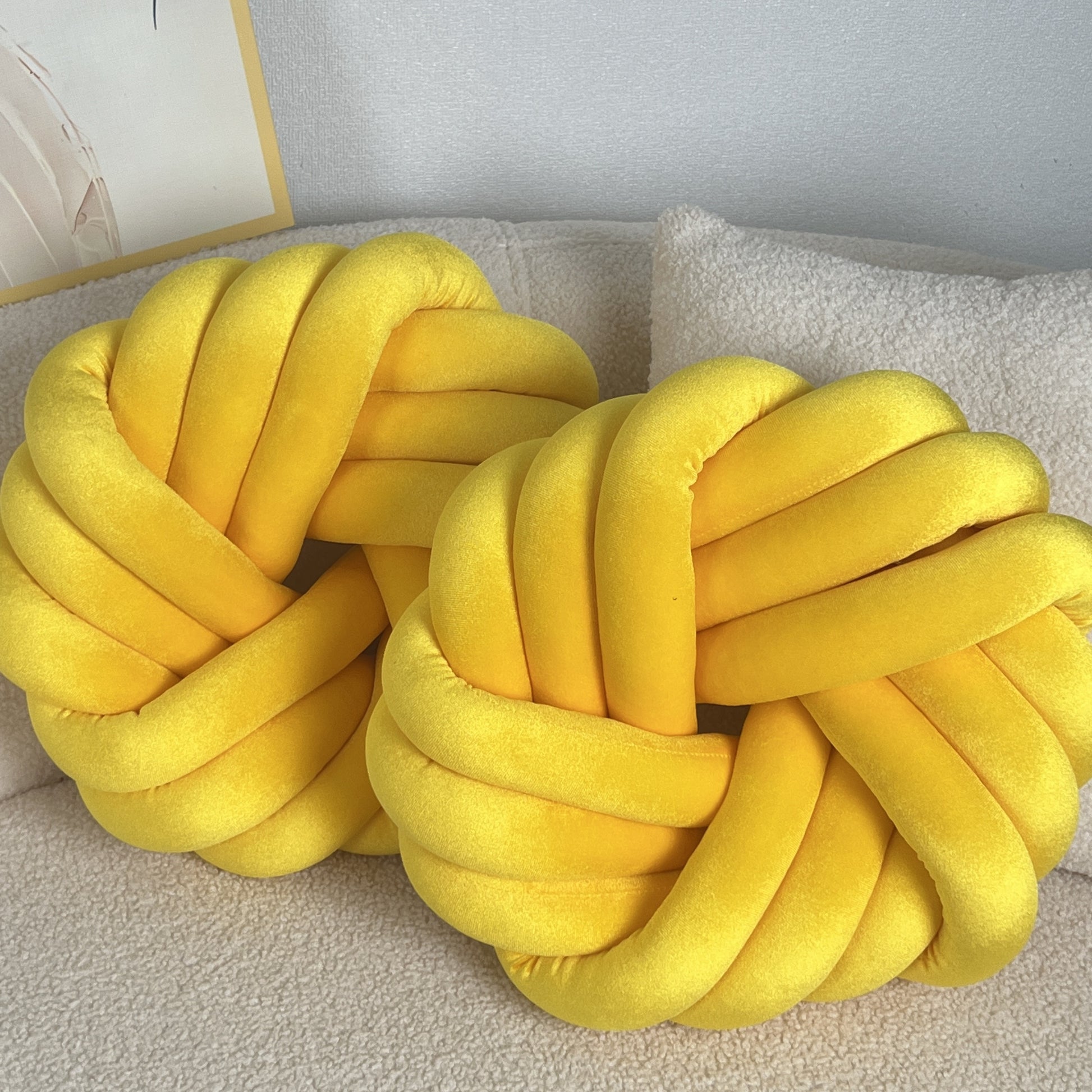 Two Piece Set Round Velvet Knot Cushion in bright yellow, ideal for modern home decor and comfort.