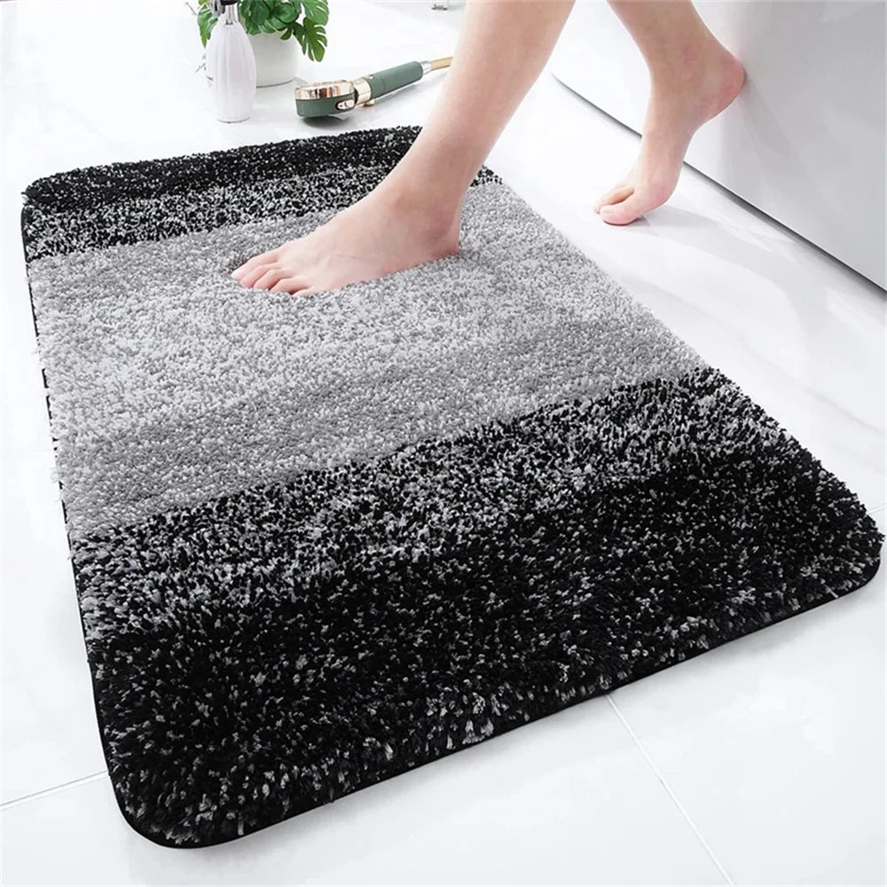 Soft U-shaped bath mat for toilet in gray and black color, providing comfort and style for bathroom decor