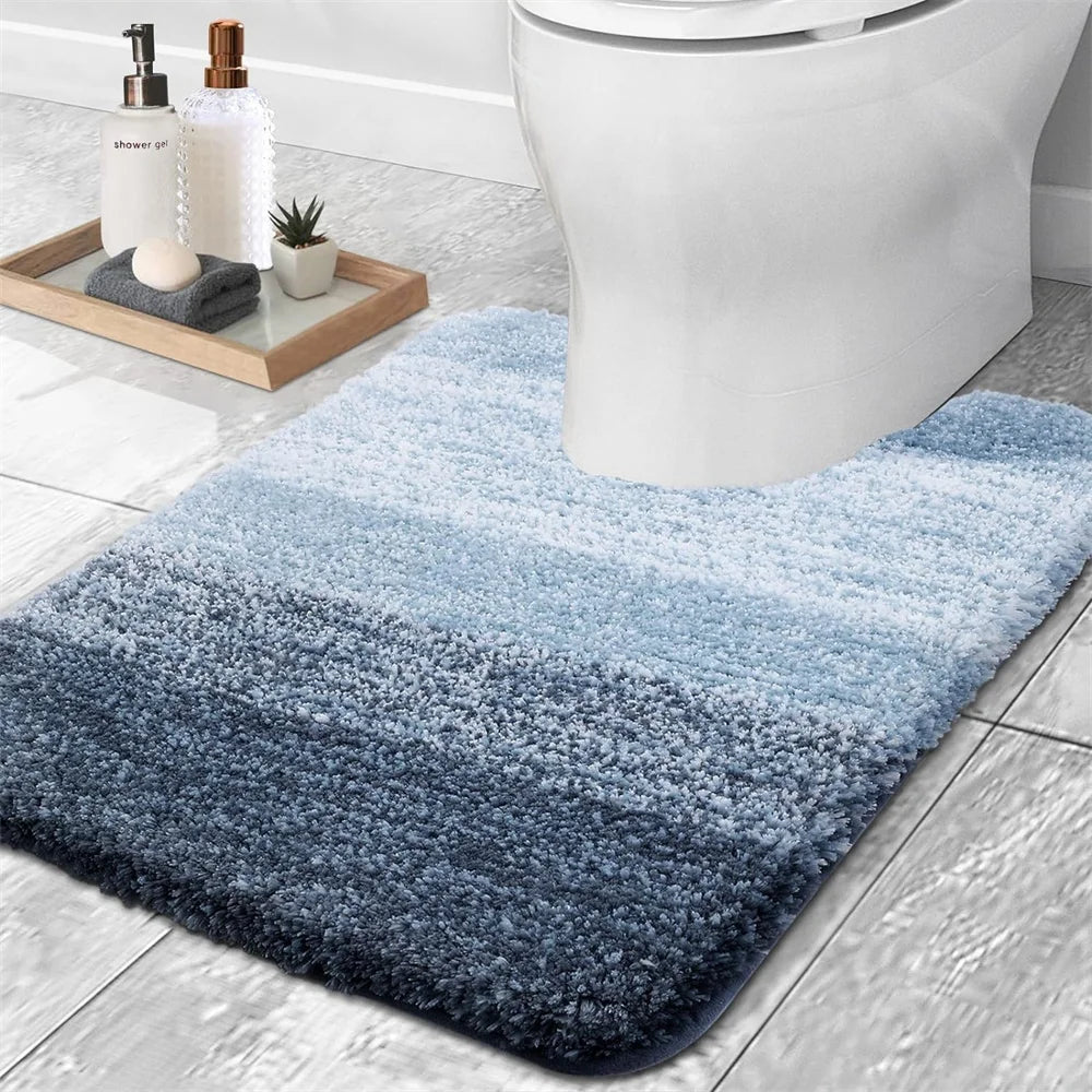 Soft blue gradient U-shaped bath mat for toilet with plush texture and modern design
