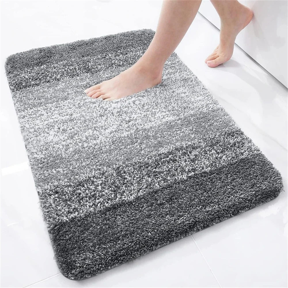 Soft gray U-shaped bath mat for toilet, providing comfort and style in your bathroom
