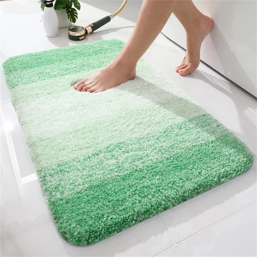 Soft green U-shaped bath mat for toilet with plush texture and stylish gradient design