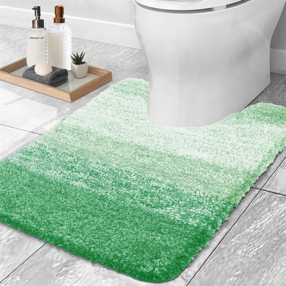 Soft green U-shaped bath mat for toilet, providing comfort and style in your bathroom