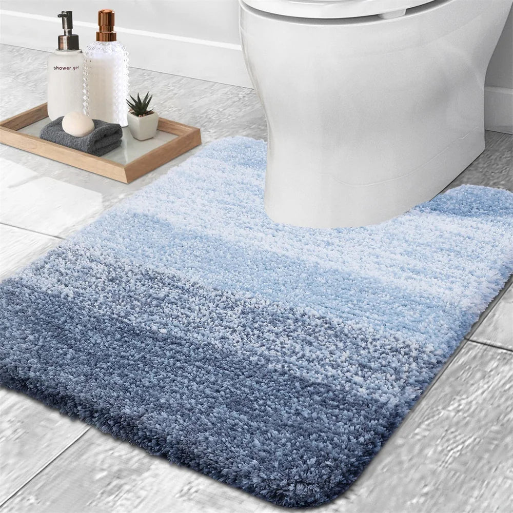 Soft U-shaped bath mat for toilet in blue gradient design, perfect for adding comfort to your bathroom