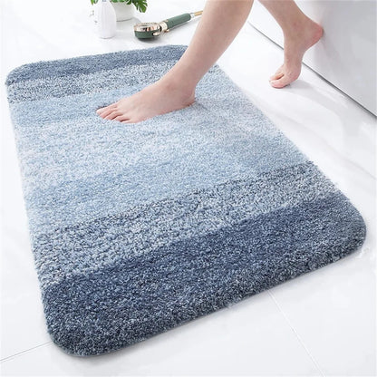 Soft and plush U-shaped bath mat for toilet in various shades of blue, enhancing bathroom comfort