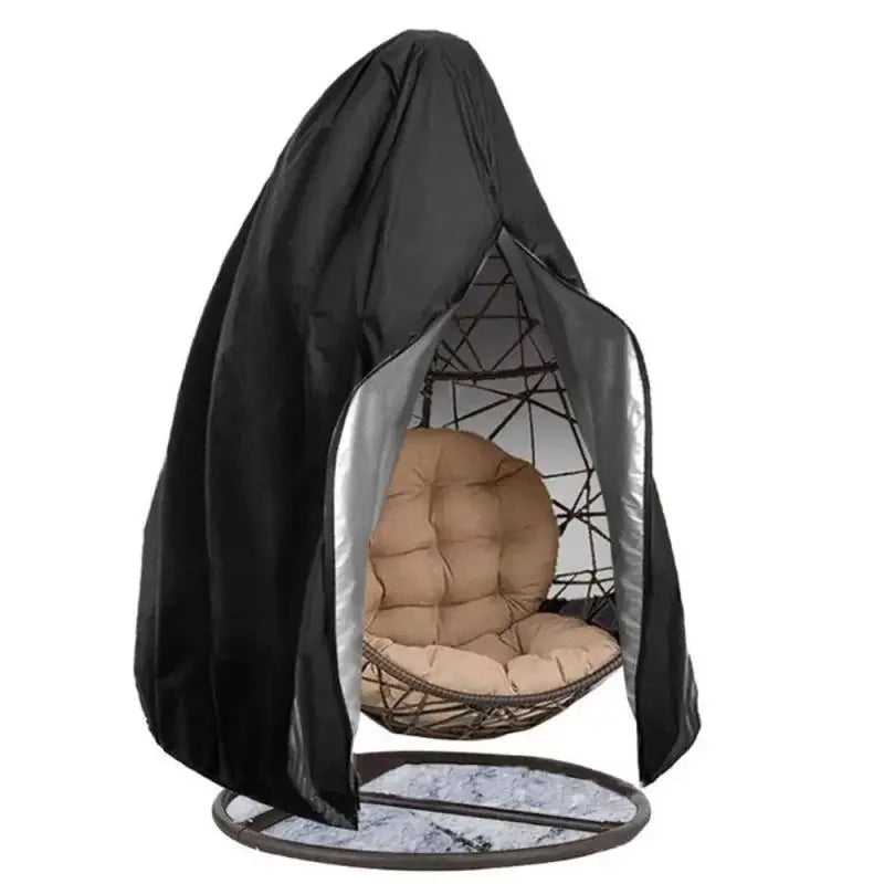 Nutshell black hanging egg chair cover partially open revealing brown cushioned rattan egg chair on metal stand