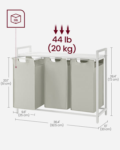 Nutshell laundry hamper with removable bags featuring three compartments for easy organizing