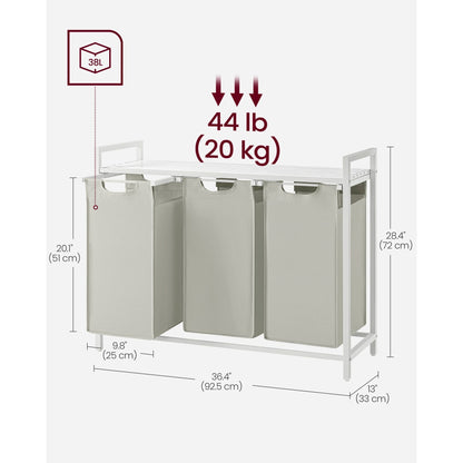 Nutshell laundry hamper with removable bags, featuring three sections and a sturdy frame for easy organization