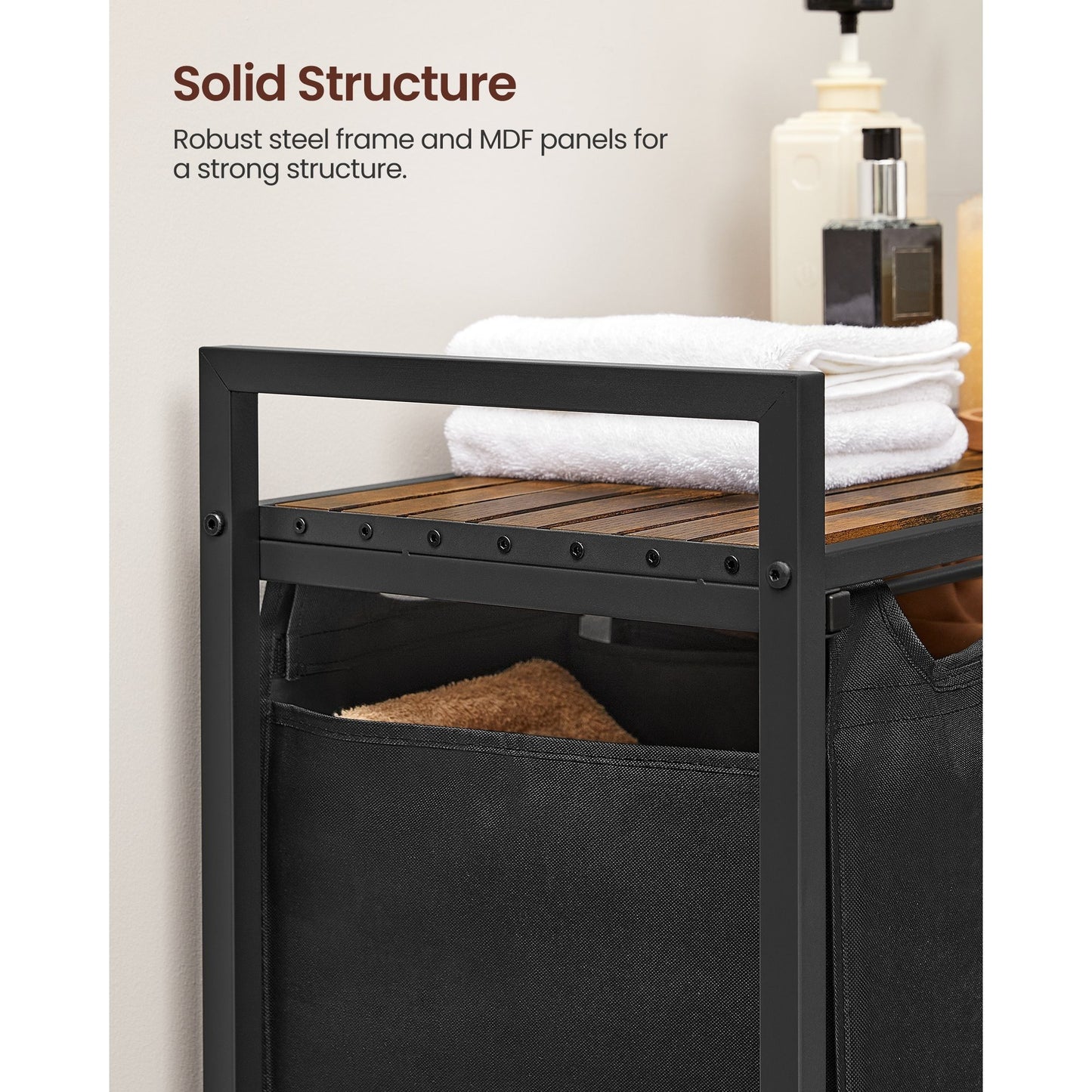 Nutshell laundry hamper with removable bags featuring a solid steel frame and wooden top for strength and organization