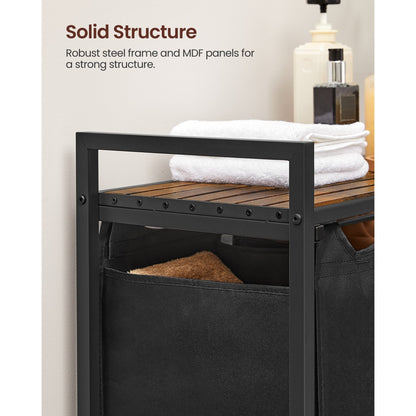 Nutshell laundry hamper with removable bags featuring a solid steel frame and wooden top for strength and organization