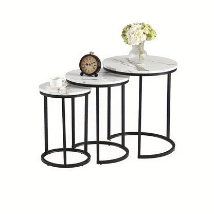 Nutshell modern side table set with three round marble tops and black metal frames