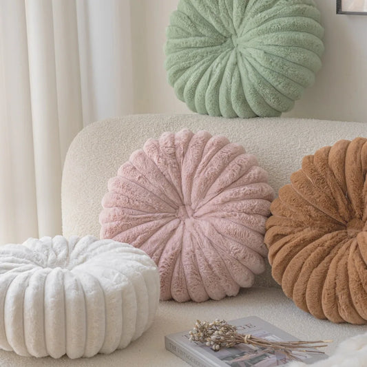 Nutshell round pumpkin pillow cushions in white pink brown and green on beige sofa