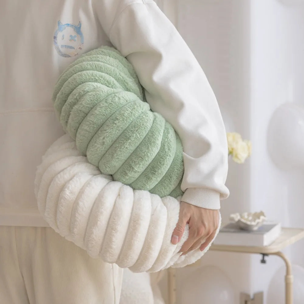 Nutshell soft plush round pumpkin pillow cushion in green and white held by person