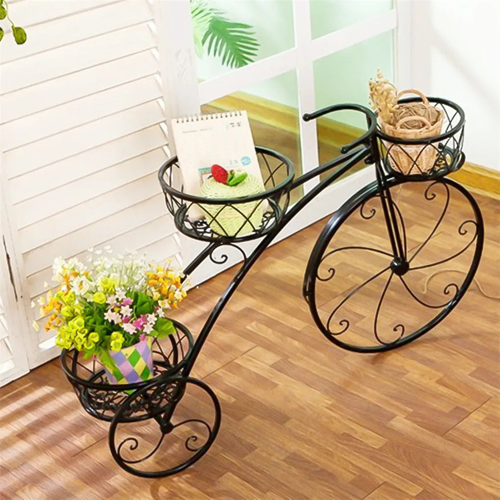 Nutshell rustic iron flower stand in bicycle design with three baskets holding flowers and decor