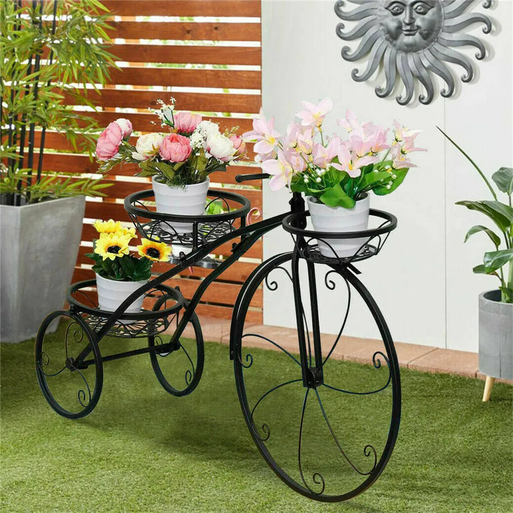 Nutshell rustic iron flower stand shaped like a vintage bicycle holding three flower pots outdoors