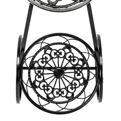 Nutshell rustic iron flower stand with decorative circular wrought iron design and sturdy wheels