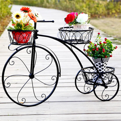 Nutshell rustic iron flower stand shaped like a vintage bicycle with three baskets holding colorful flowers