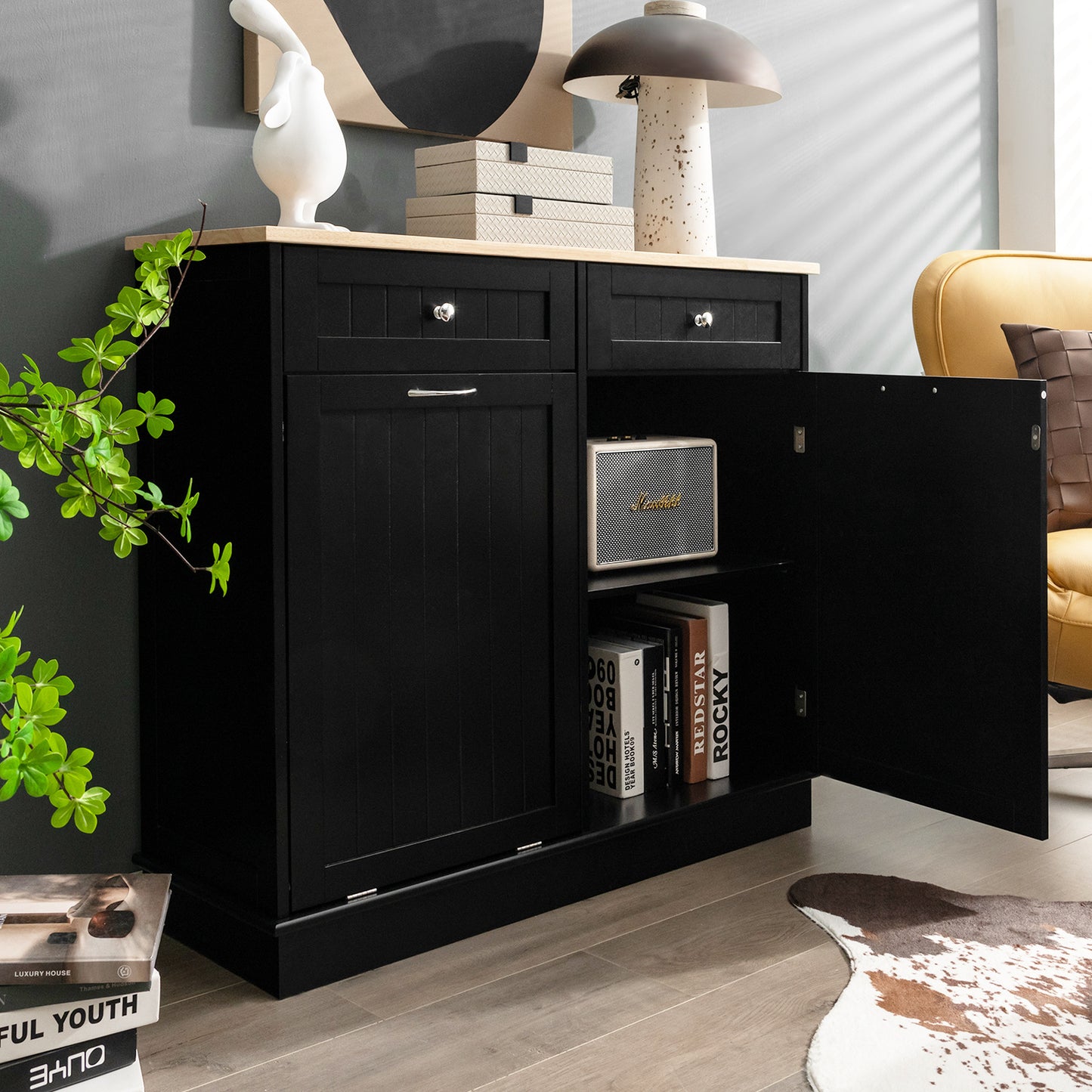 Nutshell black tilt-out trash cabinet with open door showing storage space and wooden countertop