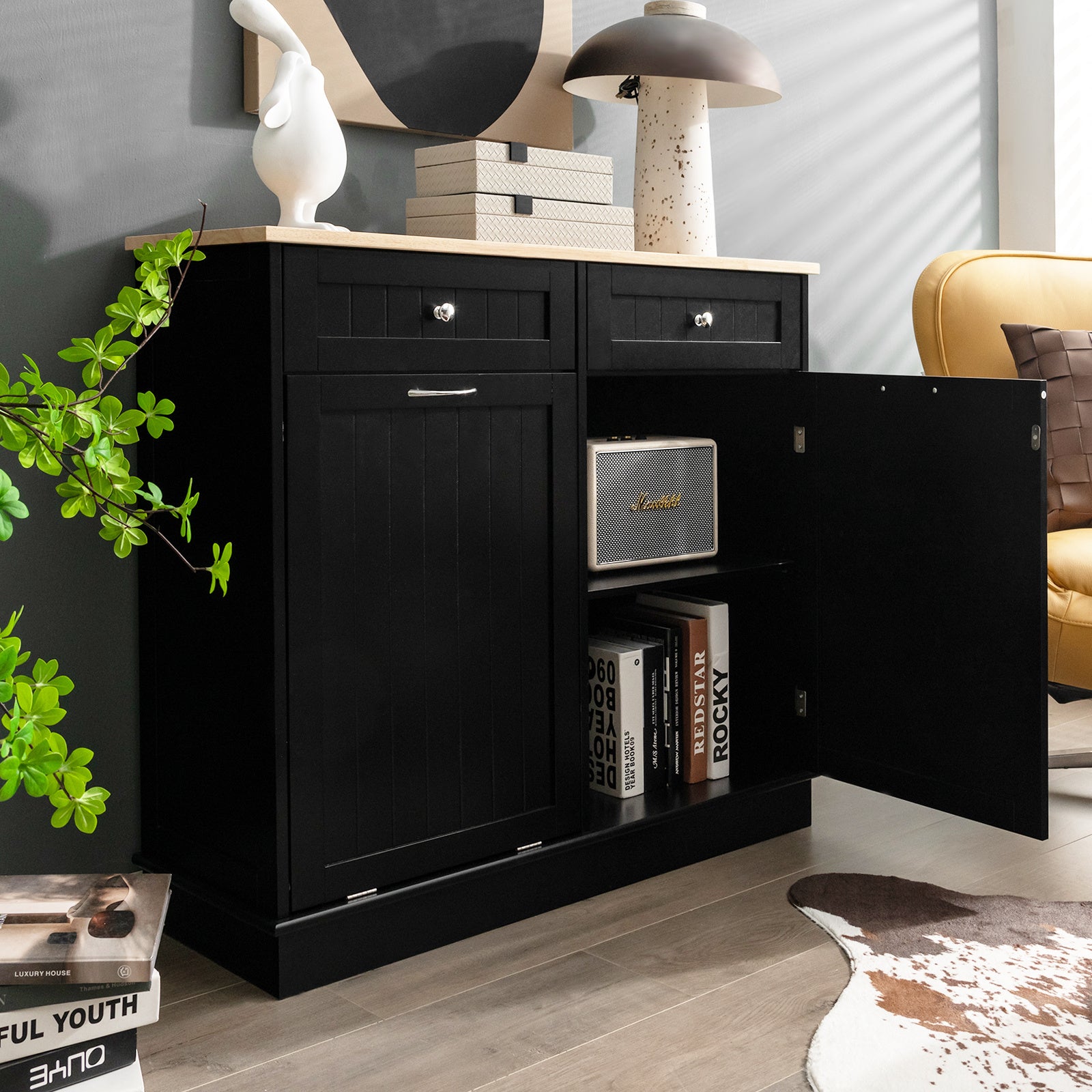 Nutshell black tilt-out trash cabinet with open door showing storage space and wooden countertop
