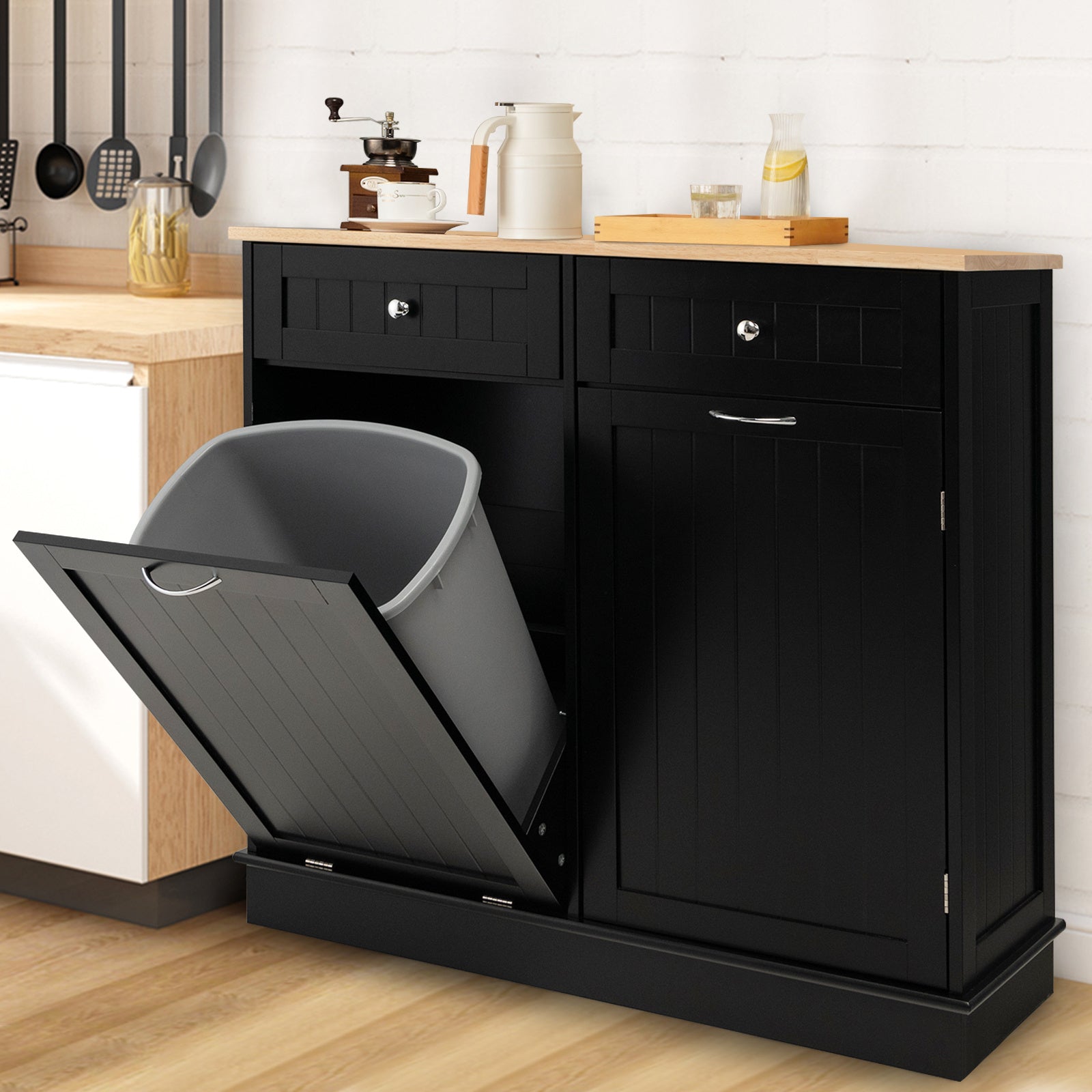 Nutshell black wooden tilt-out trash cabinet with dual drawers and a light wood countertop