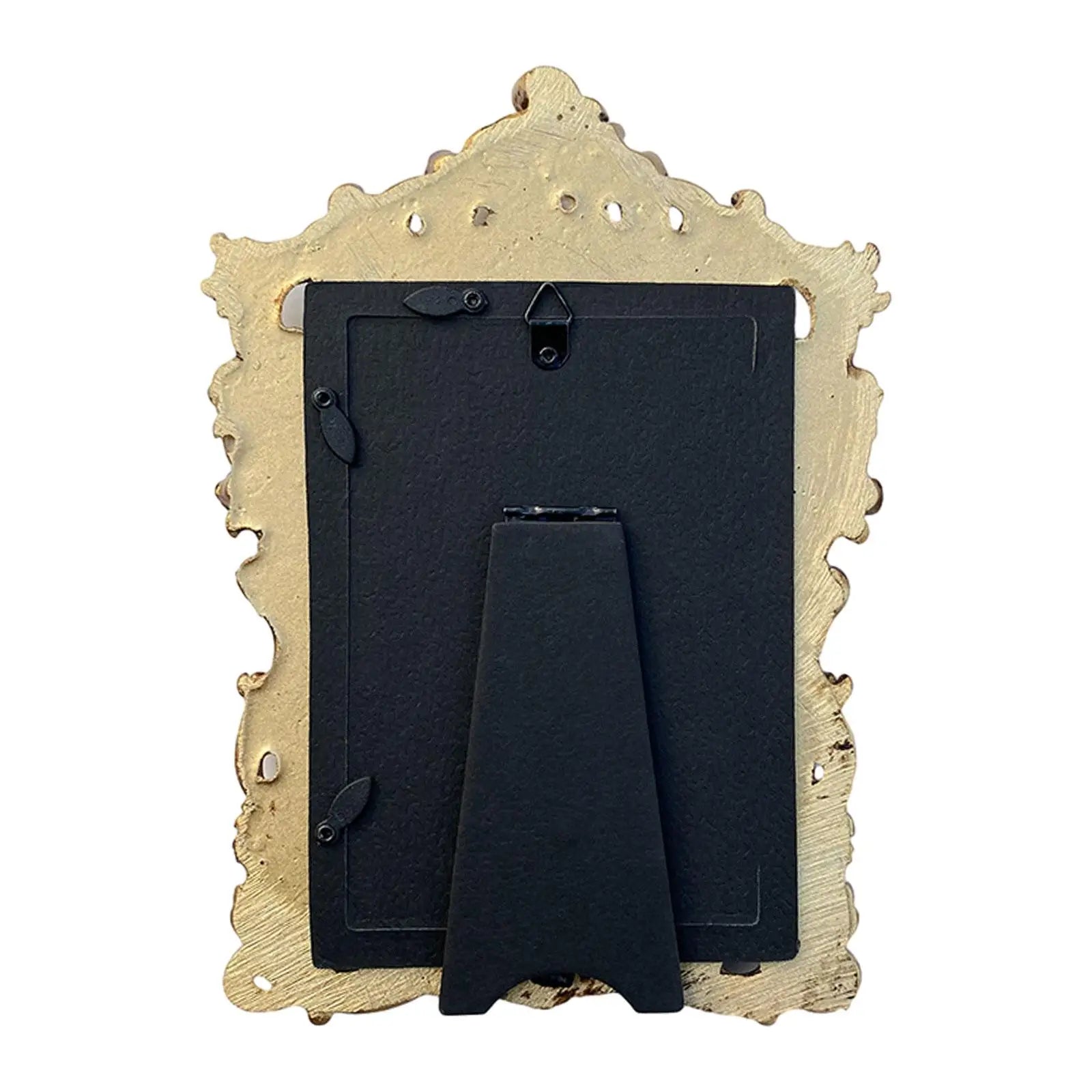 Vintage gold resin photo frame with intricate detailing and a sturdy stand for displaying memories