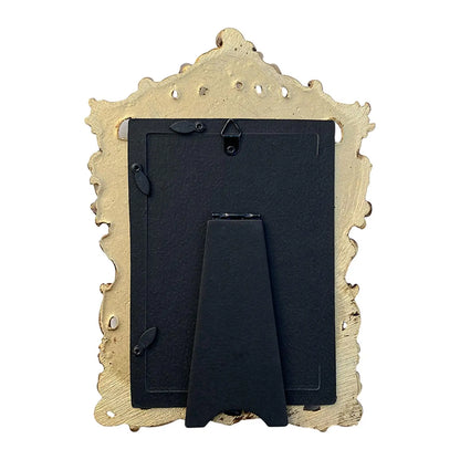 Vintage gold resin photo frame with intricate detailing and a sturdy stand for displaying memories