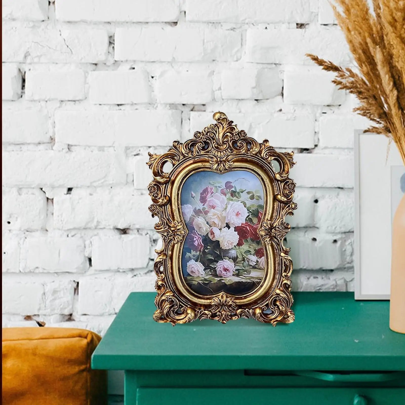 Vintage gold resin photo frame with ornate design showcasing beautiful floral artwork