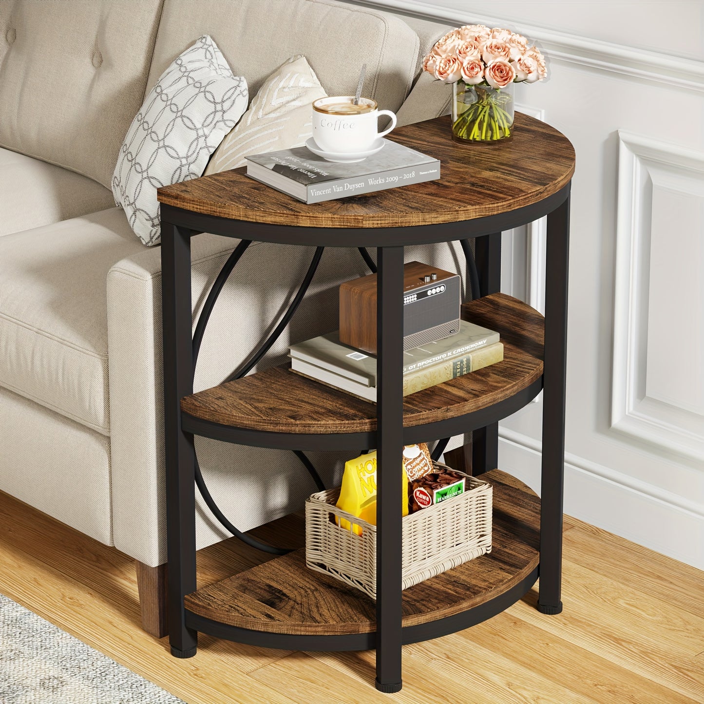 Vintage industrial end table with a round shape and shelves for storage beside a sofa
