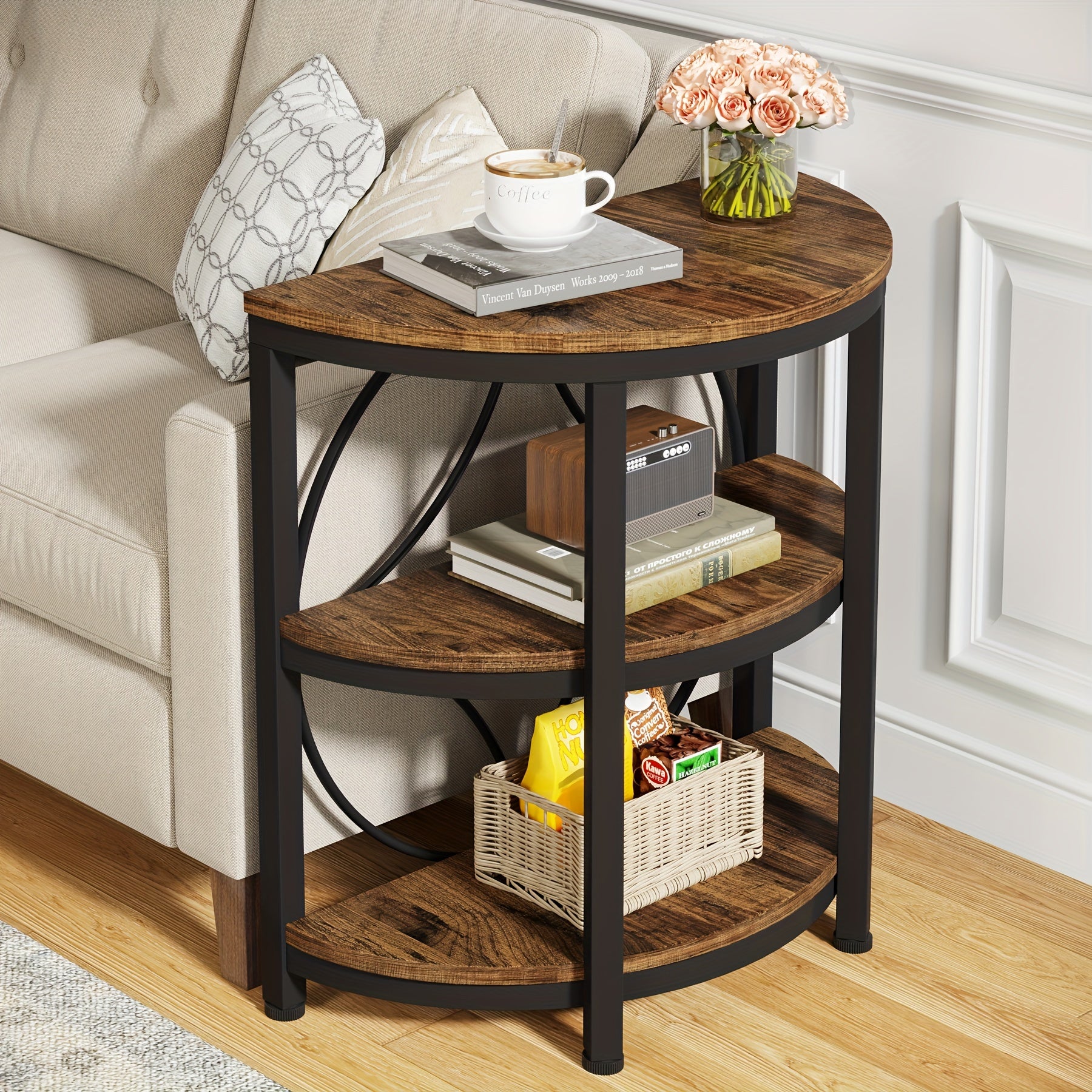 Vintage industrial end table with a round shape and shelves for storage beside a sofa