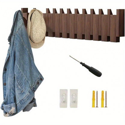 Nutshell wall mounted wooden coat hook featuring a stylish design with a jacket and a hat hanging