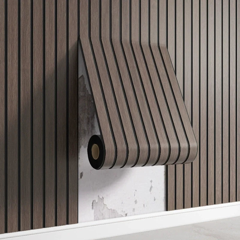 Nutshell woodgrain wallpaper roll in dark brown vertical slat pattern peeling to reveal plaster wall